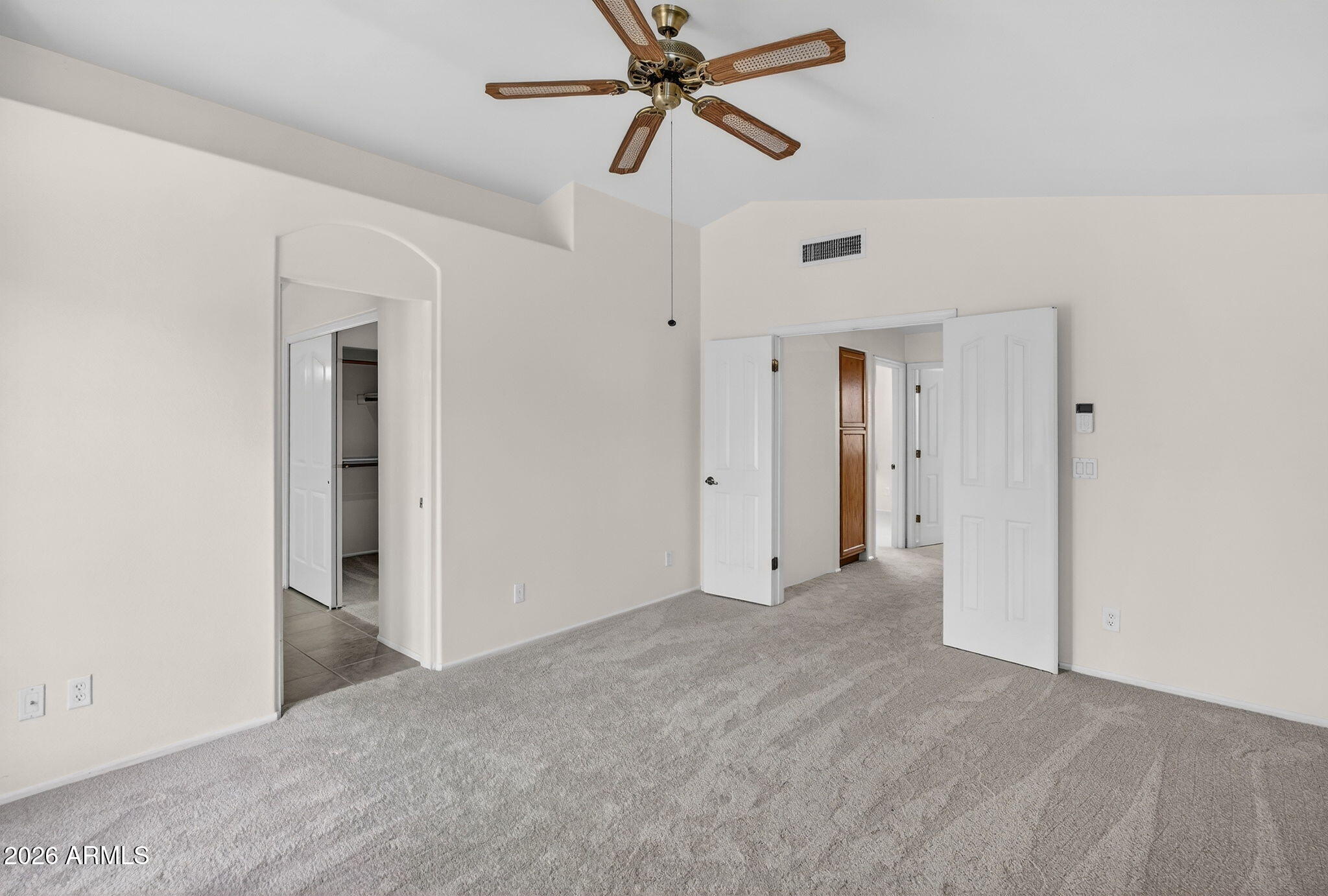 310 East Vaughn Avenue Gilbert, AZ 85234 - Photo 34 of 73 a view of a big room with closet and a chandelier fan