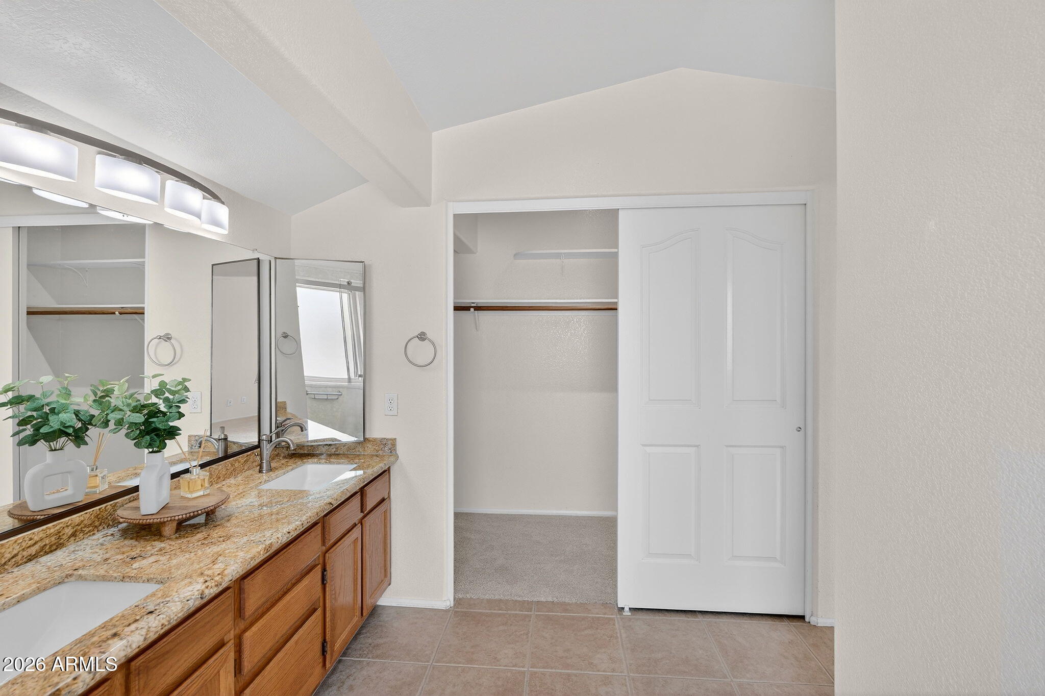 310 East Vaughn Avenue Gilbert, AZ 85234 - Photo 44 of 73 a bathroom with a granite countertop sink and a mirror