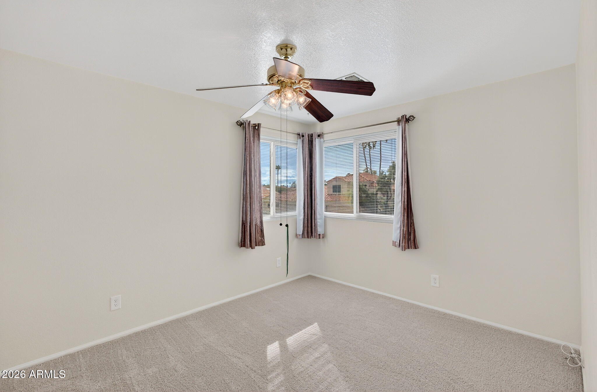 310 East Vaughn Avenue Gilbert, AZ 85234 - Photo 48 of 73 a view of a livingroom with a ceiling fan and window