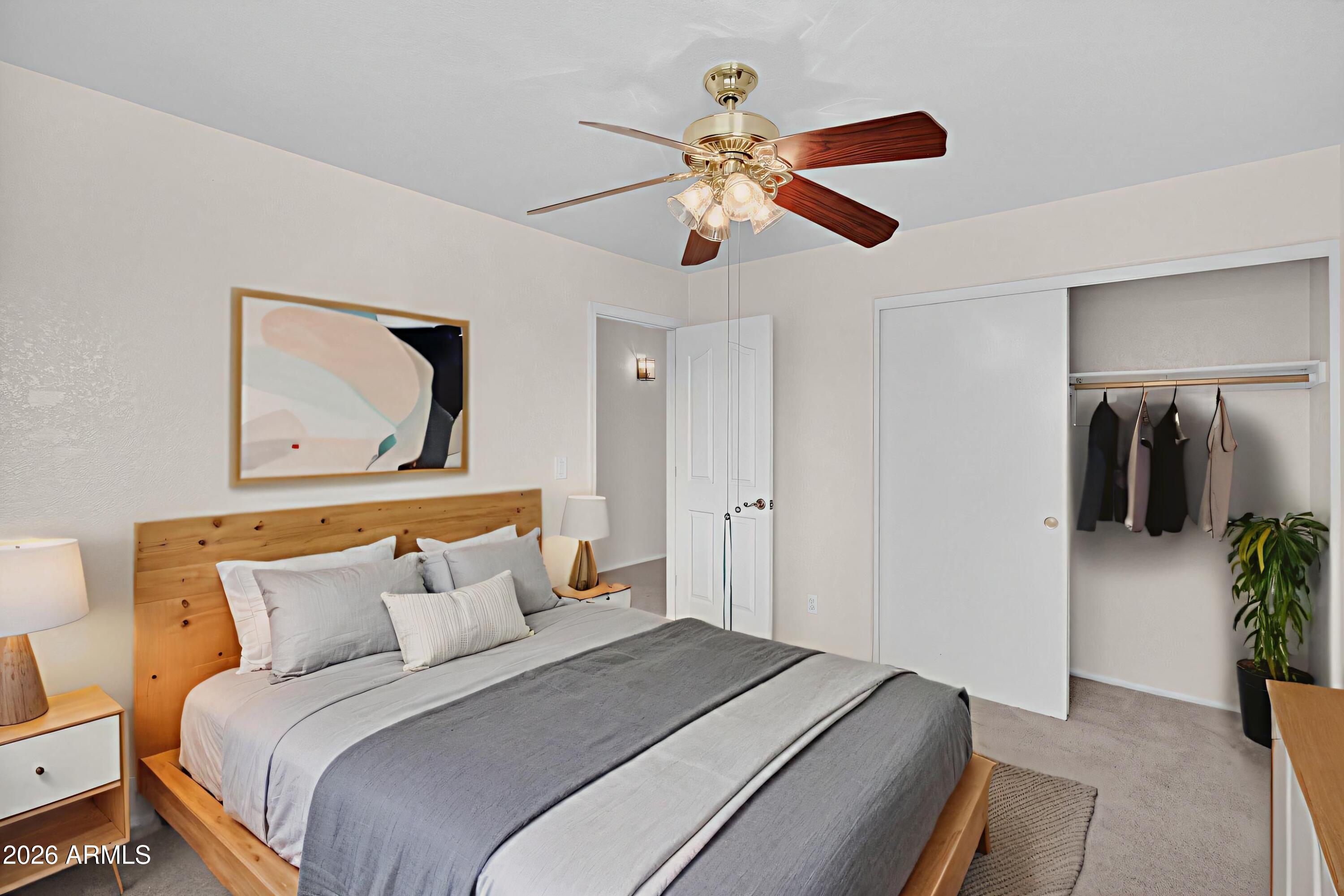 310 East Vaughn Avenue Gilbert, AZ 85234 - Photo 49 of 73 a bedroom with a bed and a painting on the wall