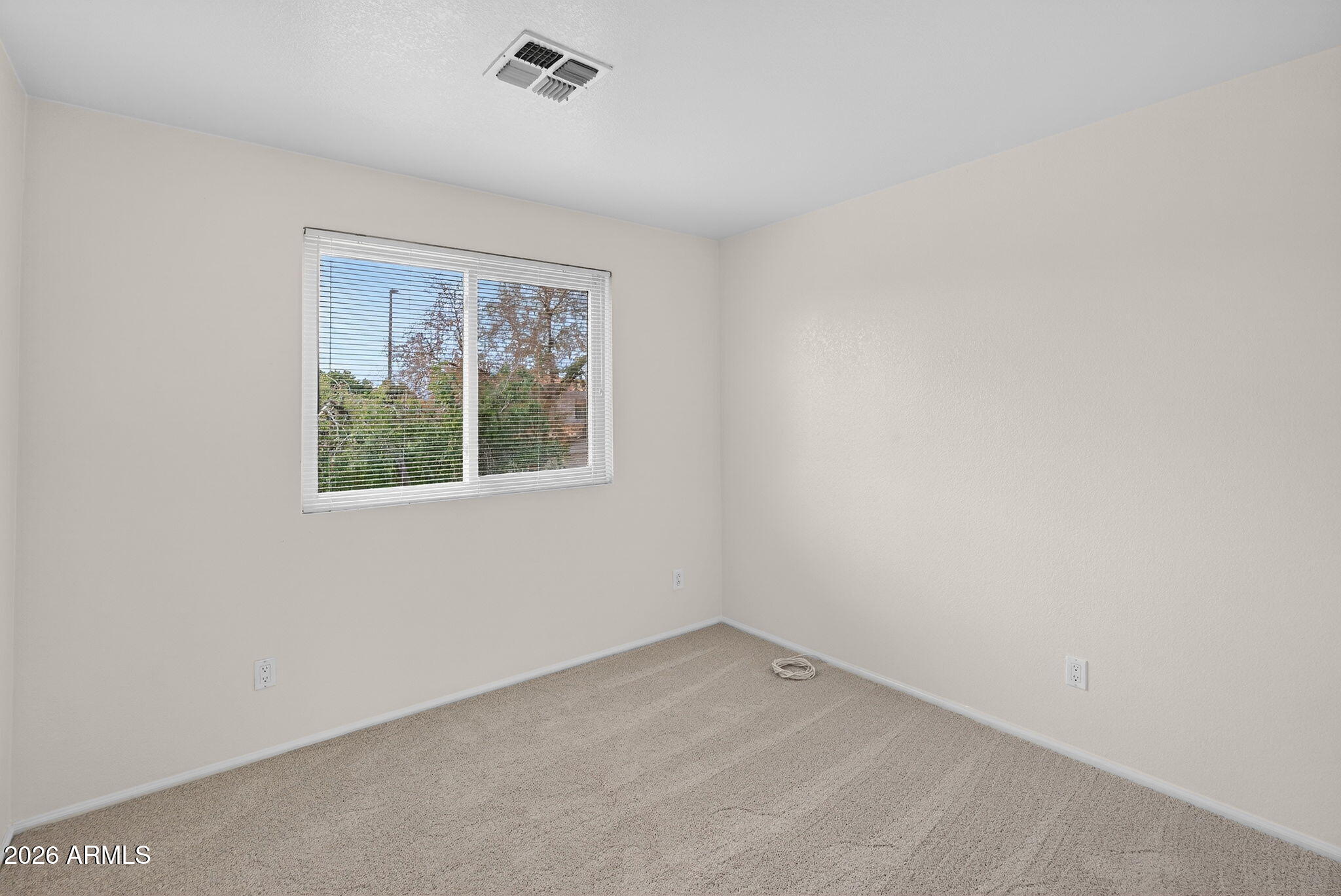 310 East Vaughn Avenue Gilbert, AZ 85234 - Photo 52 of 73 an empty room with a window