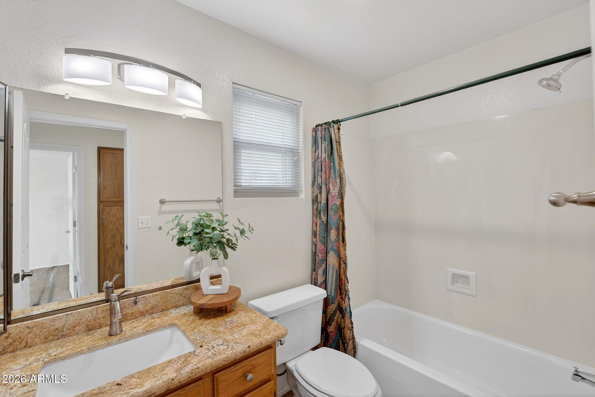 310 East Vaughn Avenue Gilbert, AZ 85234 - Photo 54 of 73 a bathroom with a granite countertop sink toilet and shower