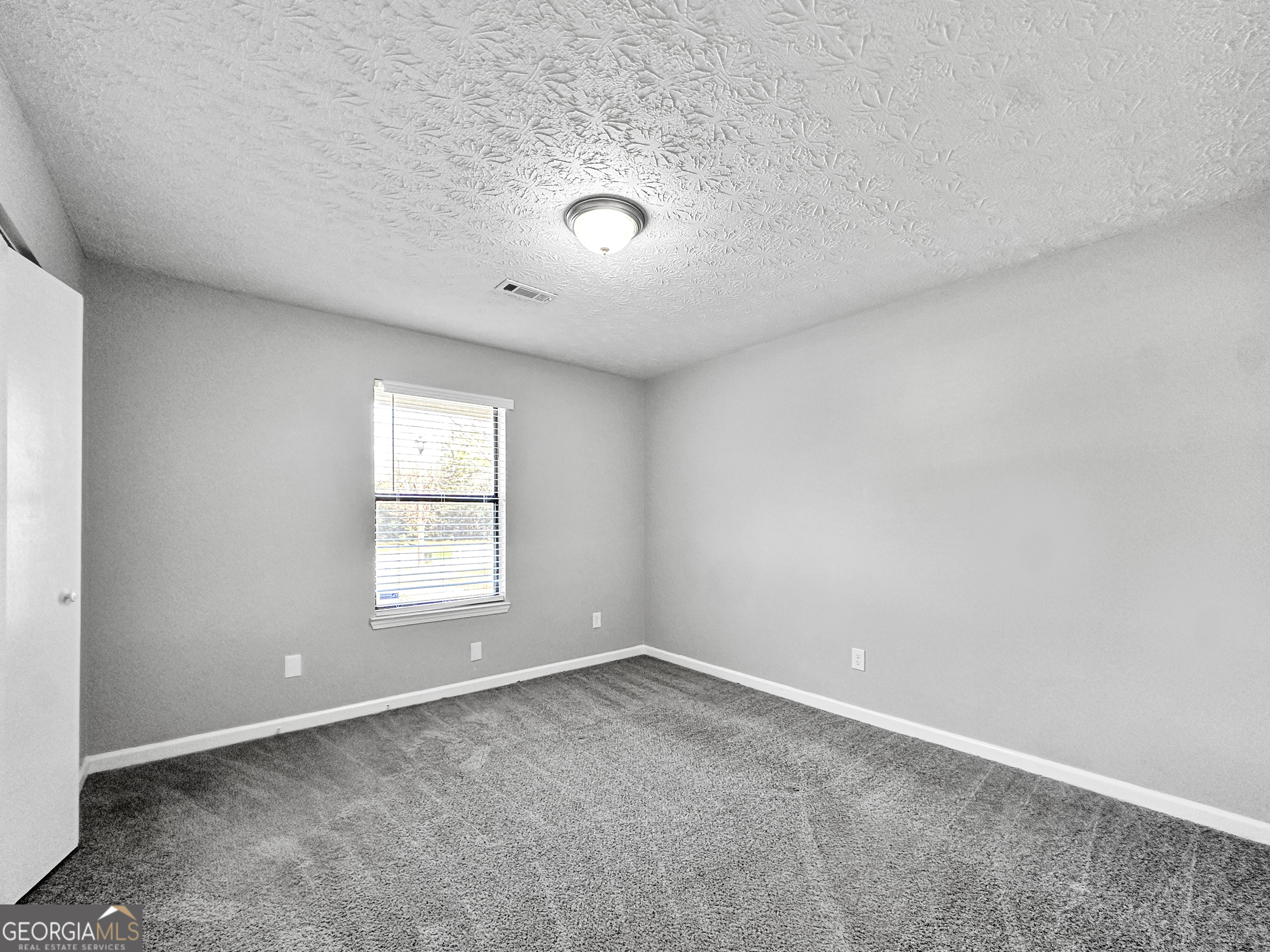 1299 Bugle Court Hampton, GA 30228 - Photo 13 of 18 an empty room with a window