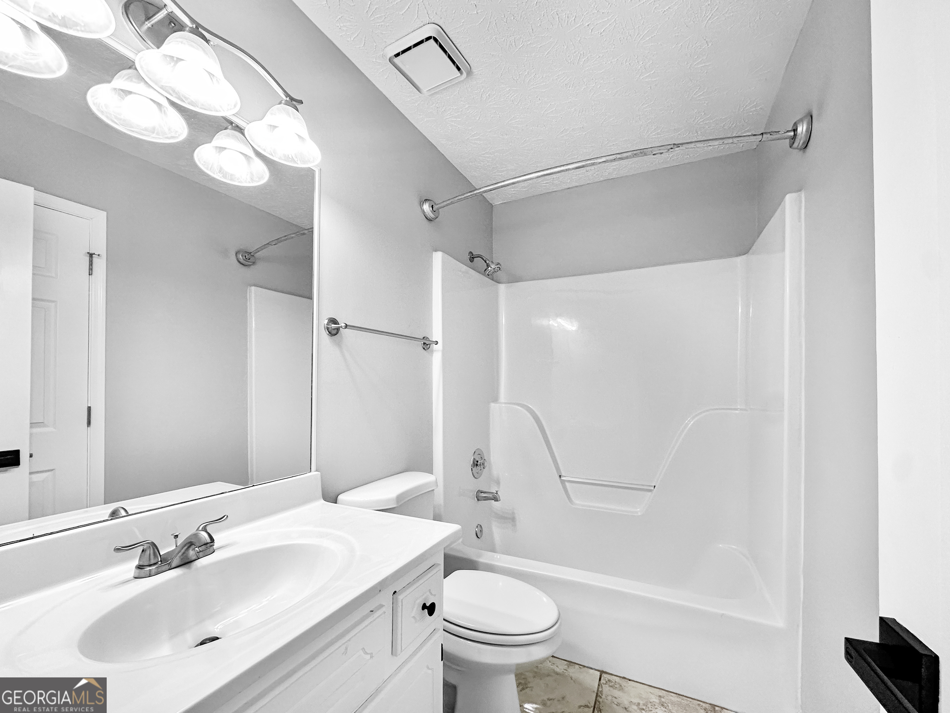 1299 Bugle Court Hampton, GA 30228 - Photo 15 of 18 a bathroom with a sink a toilet and shower