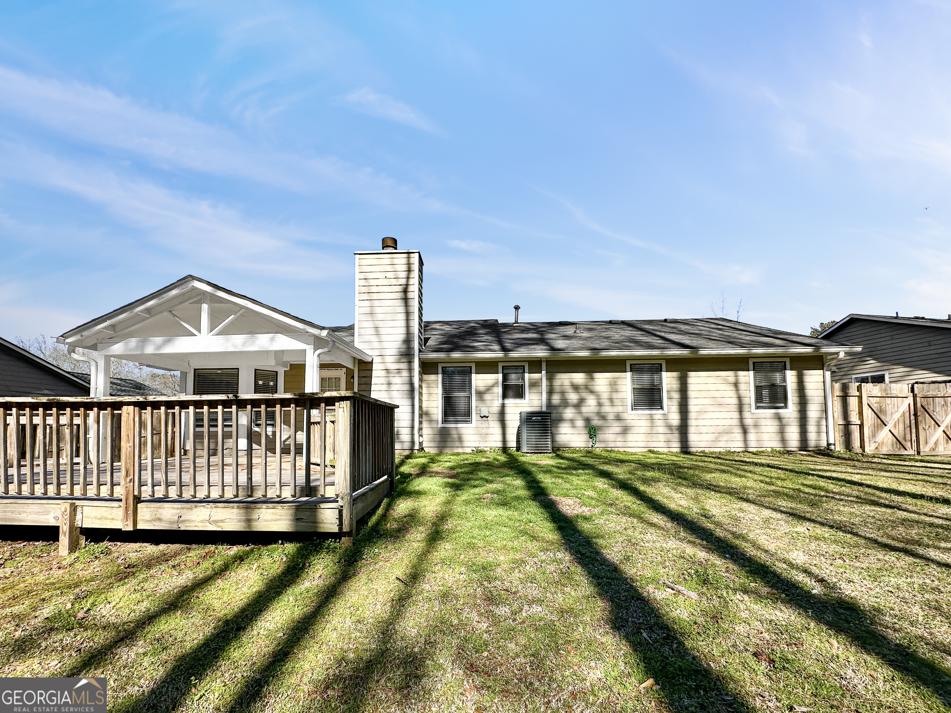 1299 Bugle Court Hampton, GA 30228 - Photo 16 of 18 a view of a house with a big yard
