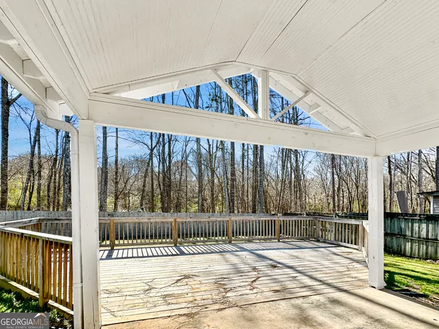 a view of a balcony with wooden floor