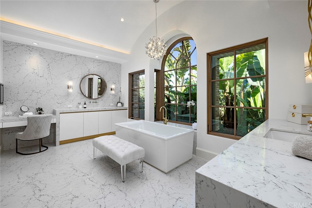 5 Clear Water Newport Coast, CA 92657 - Photo 22 of 41 a spacious bathroom with a granite countertop tub sink and mirror