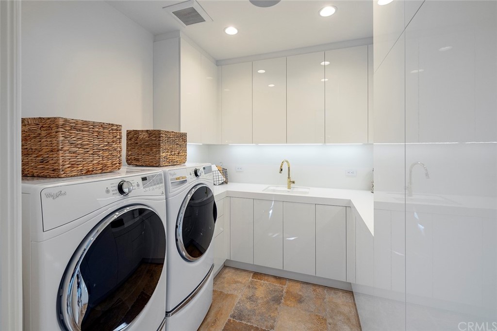 5 Clear Water Newport Coast, CA 92657 - Photo 25 of 41 a view of storage and utility room with washer and dryer