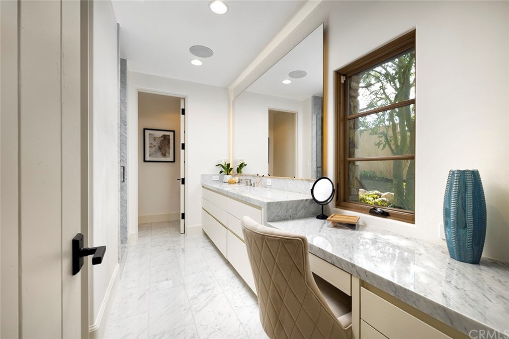 5 Clear Water Newport Coast, CA 92657 - Photo 29 of 41 a spacious en suite bathroom with a granite countertop sink and a large mirror