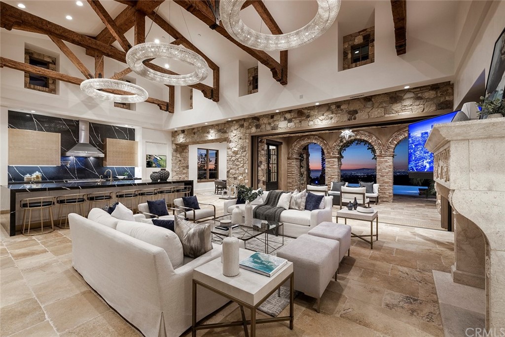 5 Clear Water Newport Coast, CA 92657 - Photo 3 of 41 a living room with furniture a fireplace and a counter top space