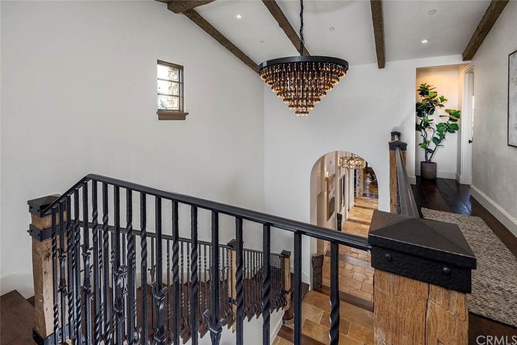 5 Clear Water Newport Coast, CA 92657 - Photo 32 of 41 a view of staircase with a table and a chandelier