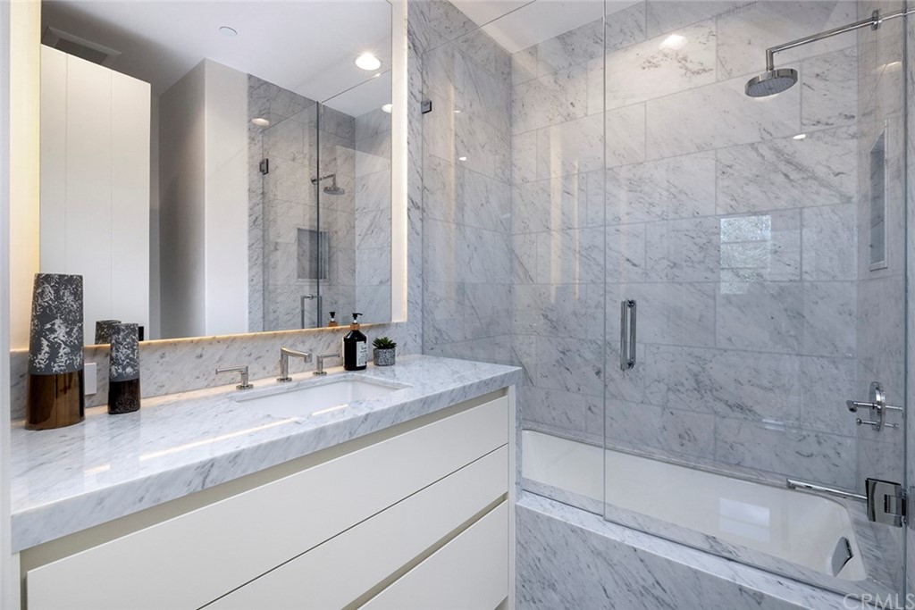 5 Clear Water Newport Coast, CA 92657 - Photo 34 of 41 a bathroom with a granite countertop sink a toilet and shower
