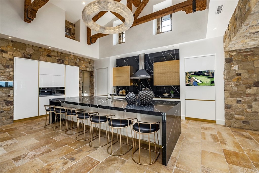 5 Clear Water Newport Coast, CA 92657 - Photo 5 of 41 a kitchen with stainless steel appliances kitchen island granite countertop a stove a refrigerator and cabinets