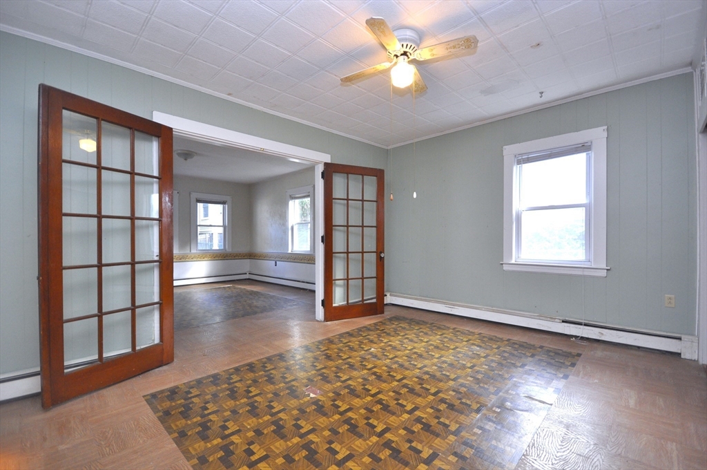164 Warren Avenue Whitman, MA 02382 - Photo 12 of 34 wooden floor in an empty room with a window
