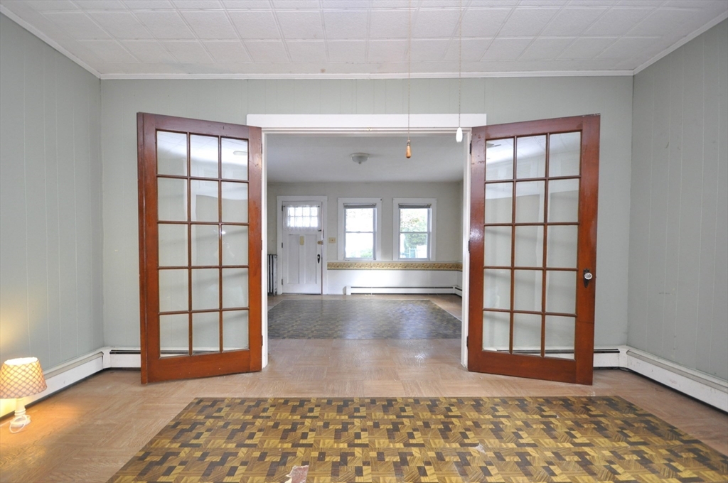164 Warren Avenue Whitman, MA 02382 - Photo 13 of 34 wooden floor in an empty room with a window