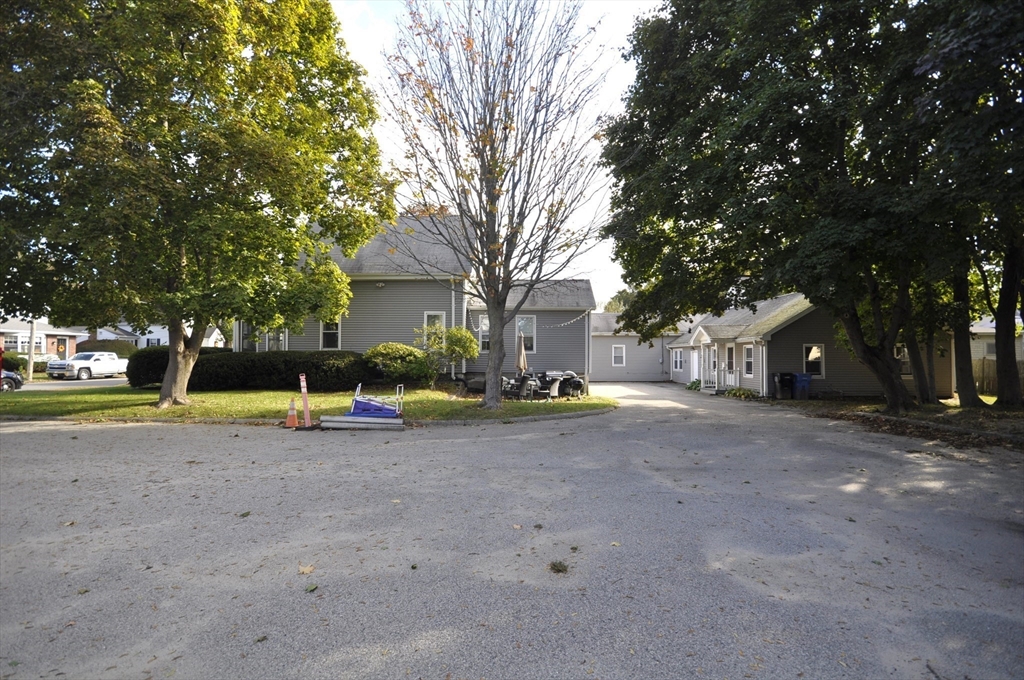 164 Warren Avenue Whitman, MA 02382 - Photo 33 of 34 a view of a house with a yard and large trees
