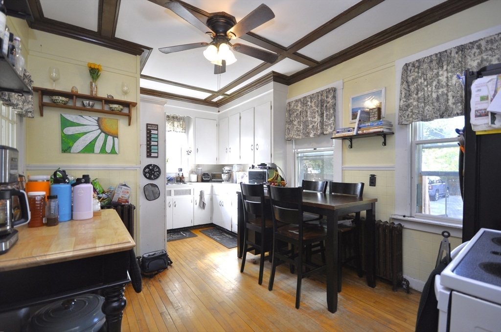 164 Warren Avenue Whitman, MA 02382 - Photo 4 of 34 a view of a dining room with furniture and wooden floor