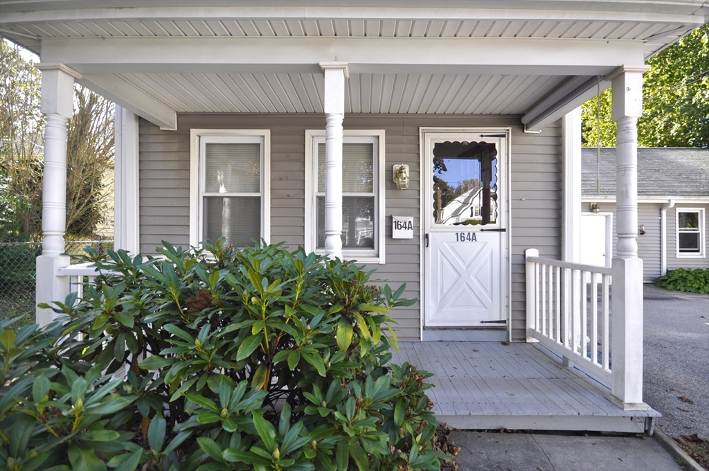 164 Warren Avenue Whitman, MA 02382 - Photo 10 of 34 a front view of a house with a porch