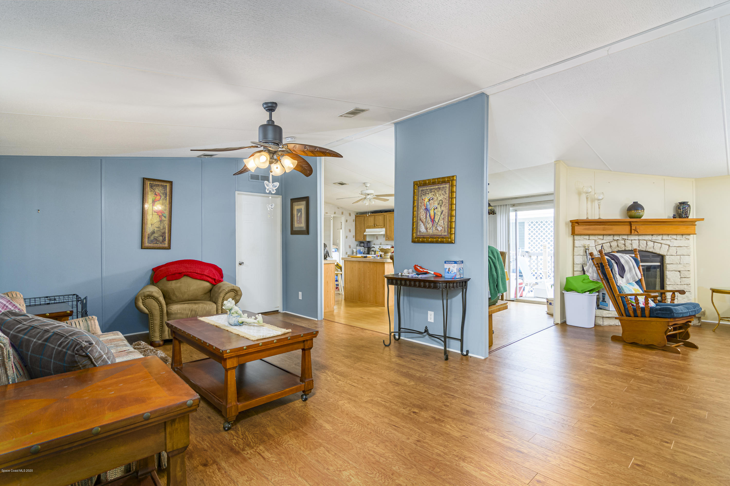 1818 Mango Street Northeast Palm Bay, FL 32905 - Photo 3 of 18 L/R Kitchen And Family Room