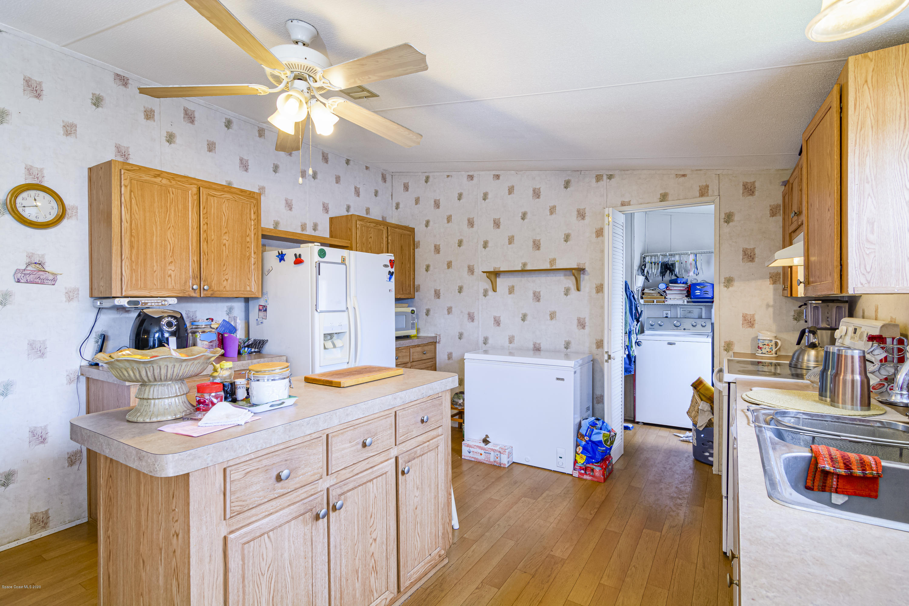1818 Mango Street Northeast Palm Bay, FL 32905 - Photo 9 of 18 Kitchen With Center Island