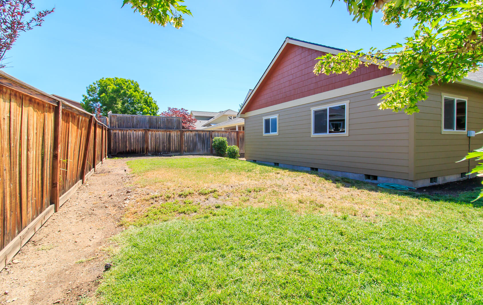 1955 Rabun Way Central Point, OR 97502 - Photo 28 of 33 a view of a backyard with a large tree