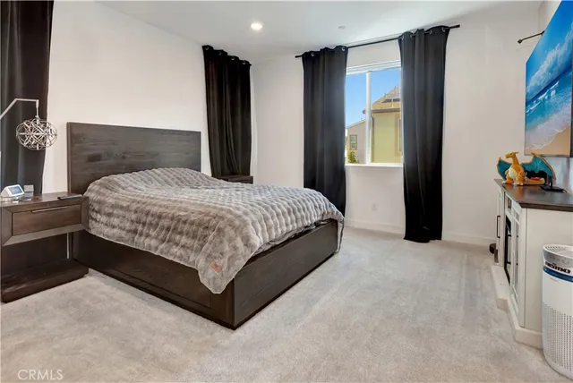 a view of a brick house with large windows and a table