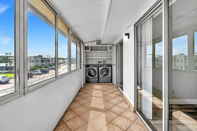 a bathroom with a large mirror and a shower
