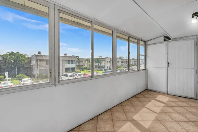 an aerial view of residential houses and outdoor space