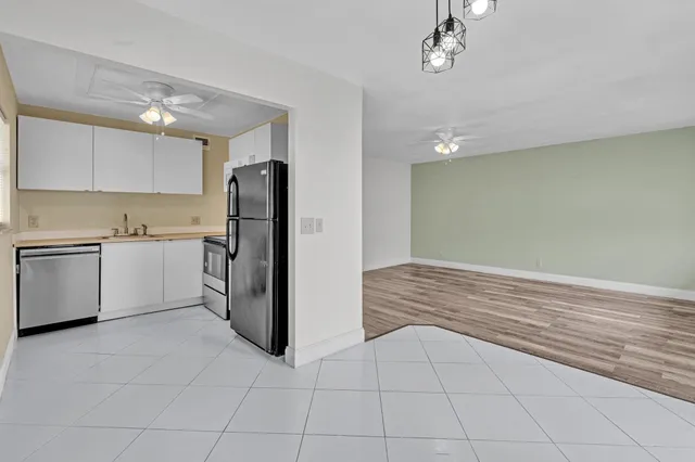 a view of a kitchen with a sink cabinets and a window