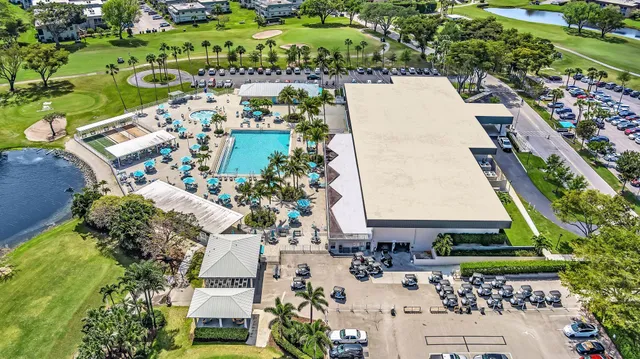 an outdoor space with swimming pool and furniture