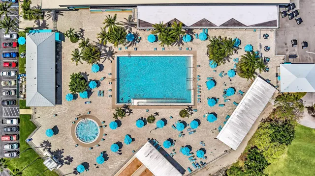 an aerial view of a house with a swimming pool