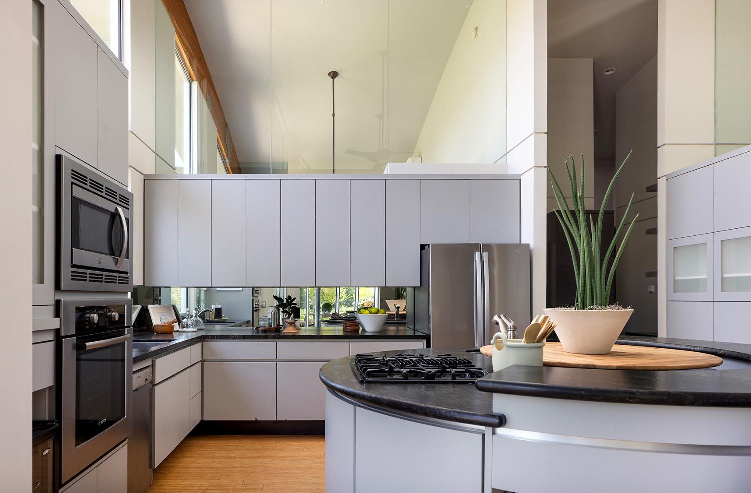26210 Elwood Road Sanger, CA 93657 - Photo 14 of 36 a kitchen with a stove a sink and a refrigerator