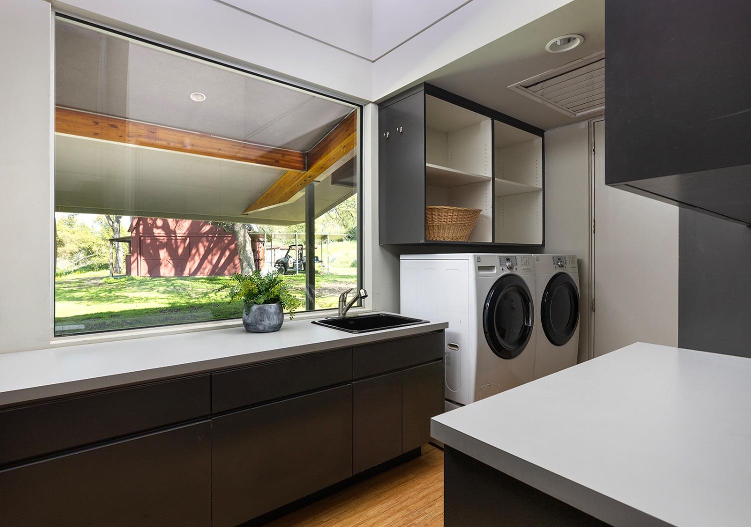26210 Elwood Road Sanger, CA 93657 - Photo 21 of 36 a kitchen with a sink a stove and a microwave