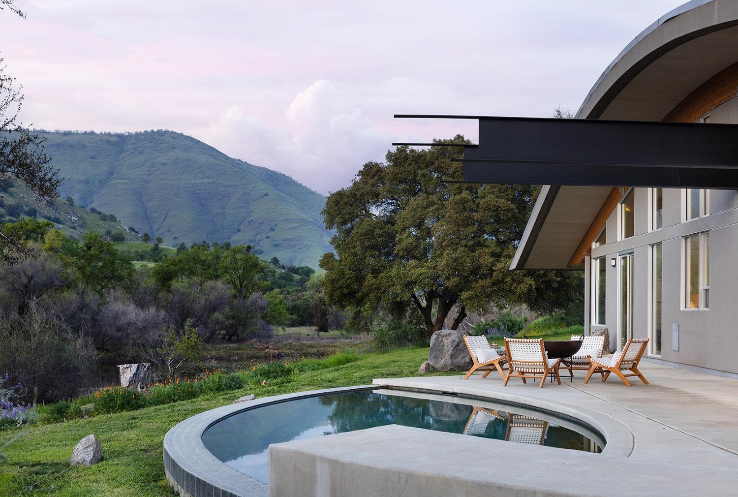 26210 Elwood Road Sanger, CA 93657 - Photo 23 of 36 a view of a house with pool and trees around