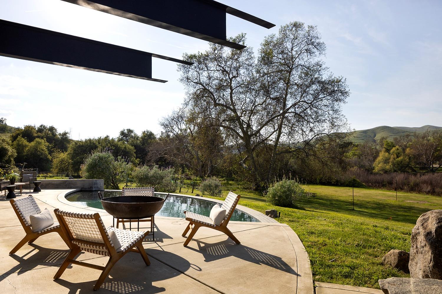 26210 Elwood Road Sanger, CA 93657 - Photo 25 of 36 a view of backyard with swimming pool and outdoor seating