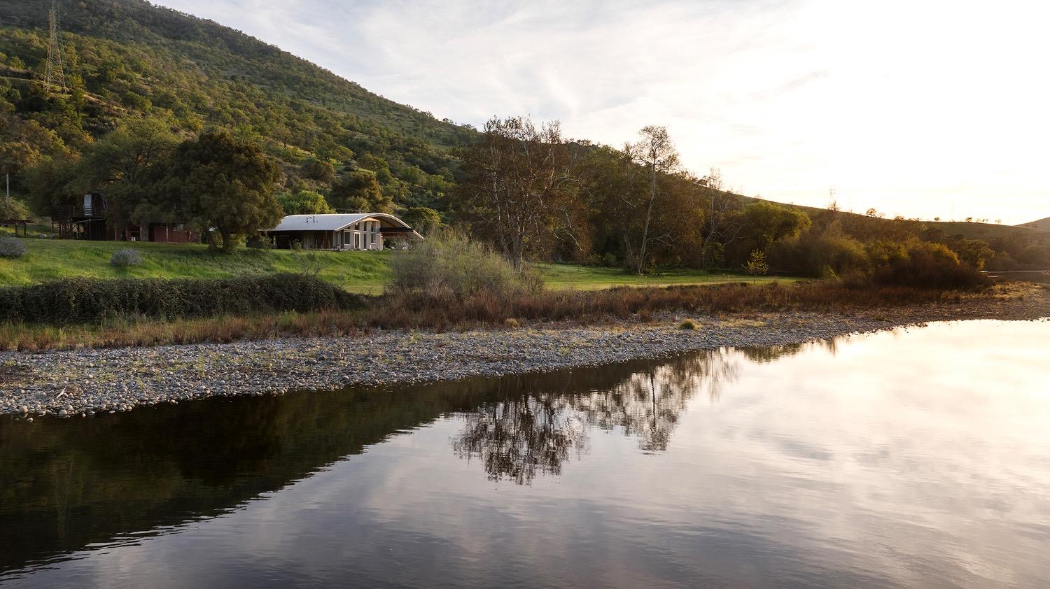 26210 Elwood Road Sanger, CA 93657 - Photo 32 of 36 a view of a lake with a mountain in the background