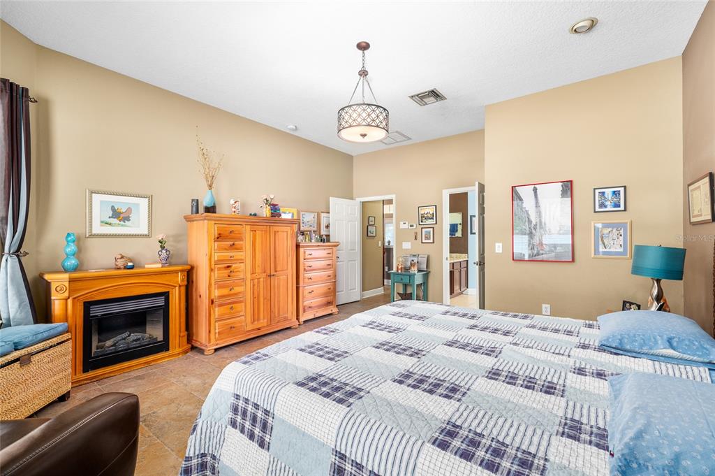 11845 Newberry Grove Loop Riverview, FL 33579 - Photo 22 of 47 a bedroom with a bed dresser and a window