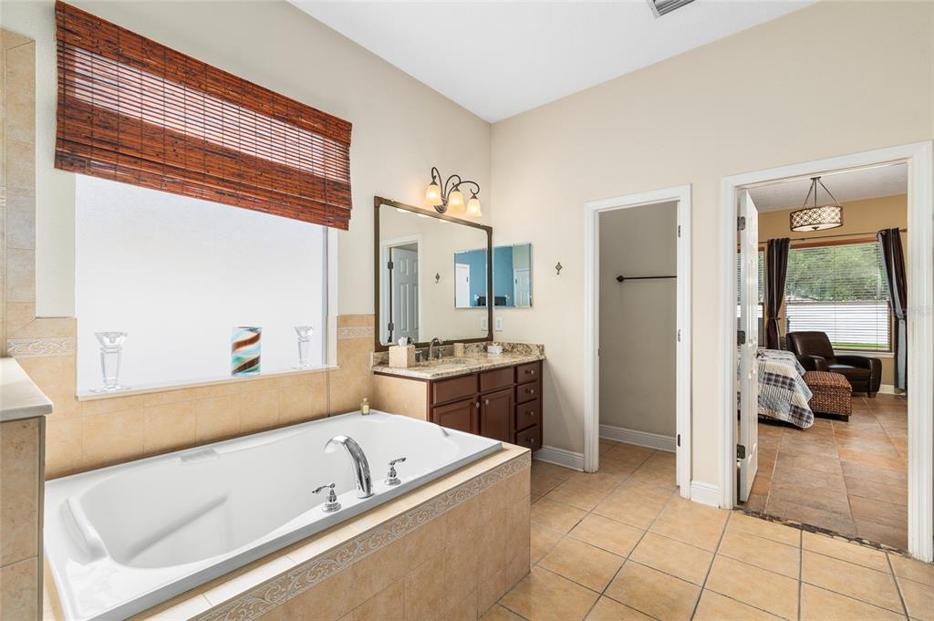 11845 Newberry Grove Loop Riverview, FL 33579 - Photo 24 of 47 a living room with a couch and a large window