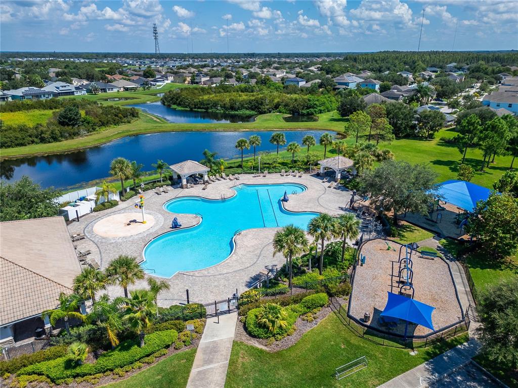 11845 Newberry Grove Loop Riverview, FL 33579 - Photo 42 of 47 an aerial view of a house with a garden and lake view