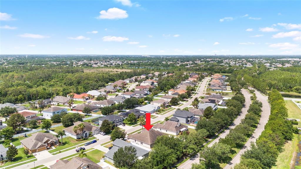 11845 Newberry Grove Loop Riverview, FL 33579 - Photo 46 of 47 an aerial view of city and lake