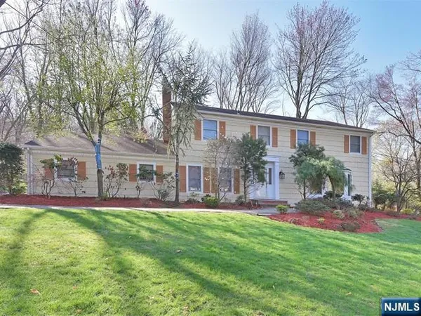 a house view with a sitting space and garden