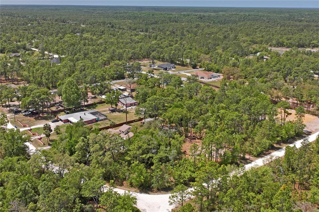 0 Yellowstone Avenue Weeki Wachee, FL 34614 - Photo 3 of 18 a view of a houses with a yard