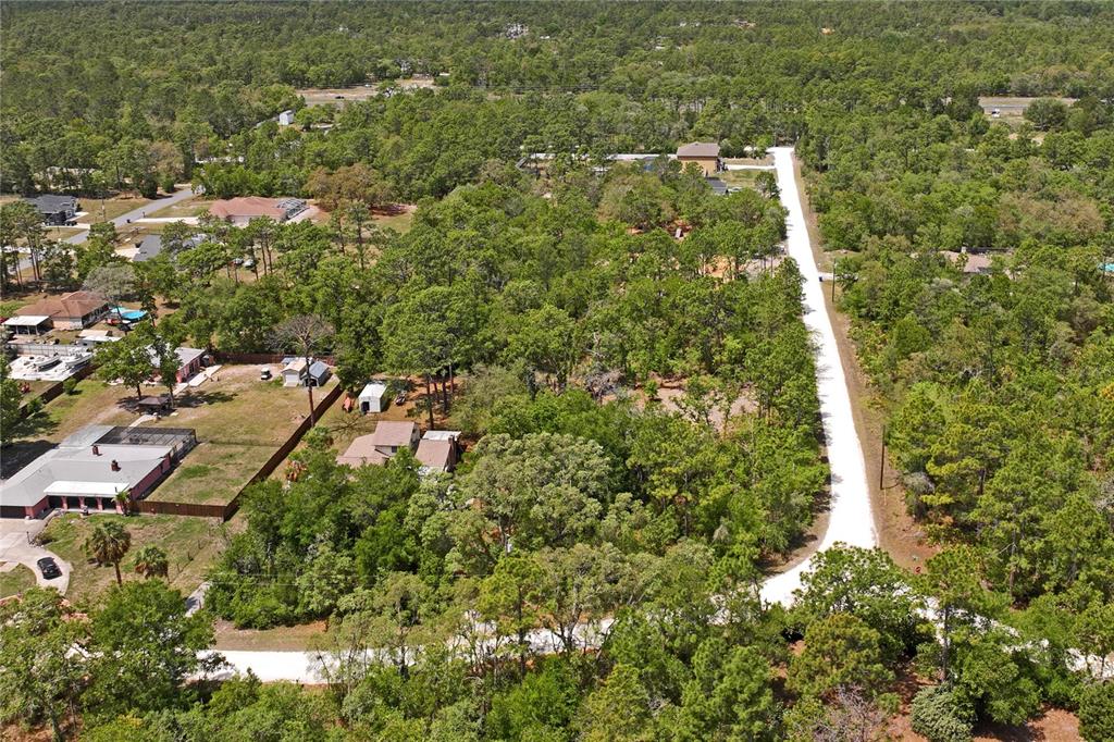 0 Yellowstone Avenue Weeki Wachee, FL 34614 - Photo 5 of 18 an aerial view of residential house with parking space and trees
