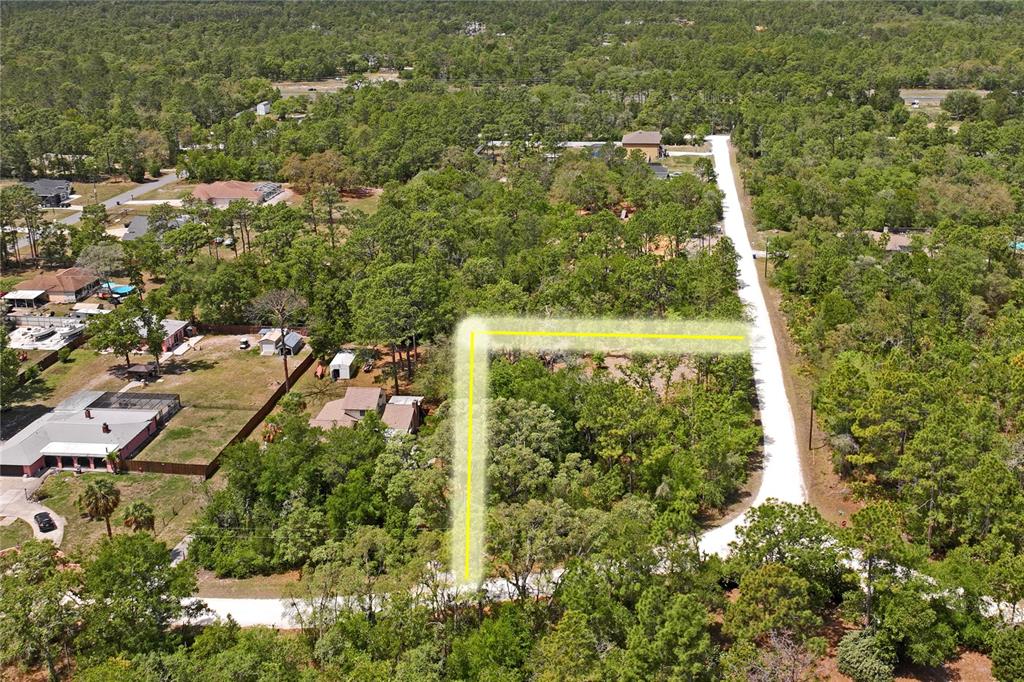 0 Yellowstone Avenue Weeki Wachee, FL 34614 - Photo 6 of 18 an aerial view of residential house with green space