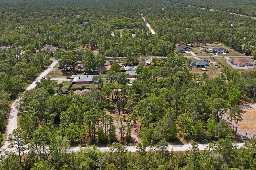 0 Yellowstone Avenue Weeki Wachee, FL 34614 - Photo 7 of 18 an aerial view of residential house with outdoor space and trees all around