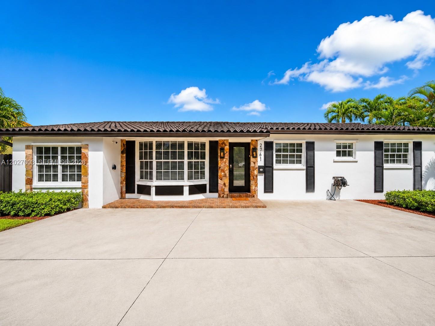 2761 Southwest 92nd Place Miami, FL 33165 - Photo 18 of 37 front view of a house with a street