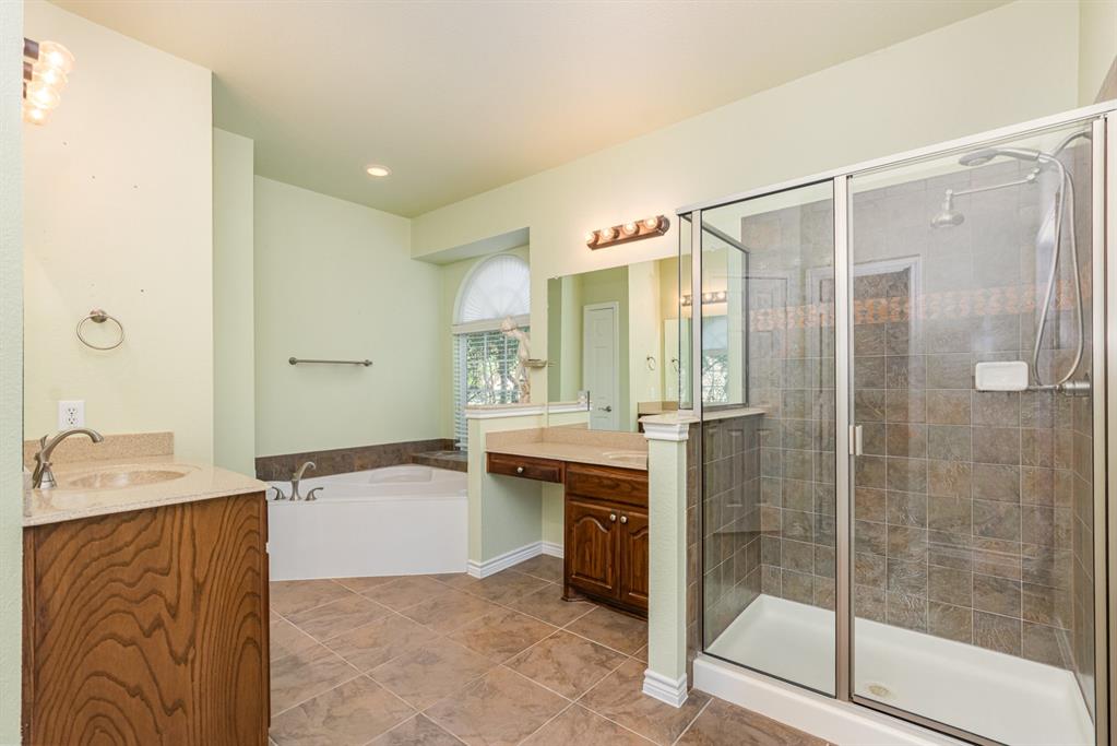 1325 Bateman Lane Celina, TX 75009 - Photo 18 of 39 a bathroom with a bathtub shower sink mirror and toilet