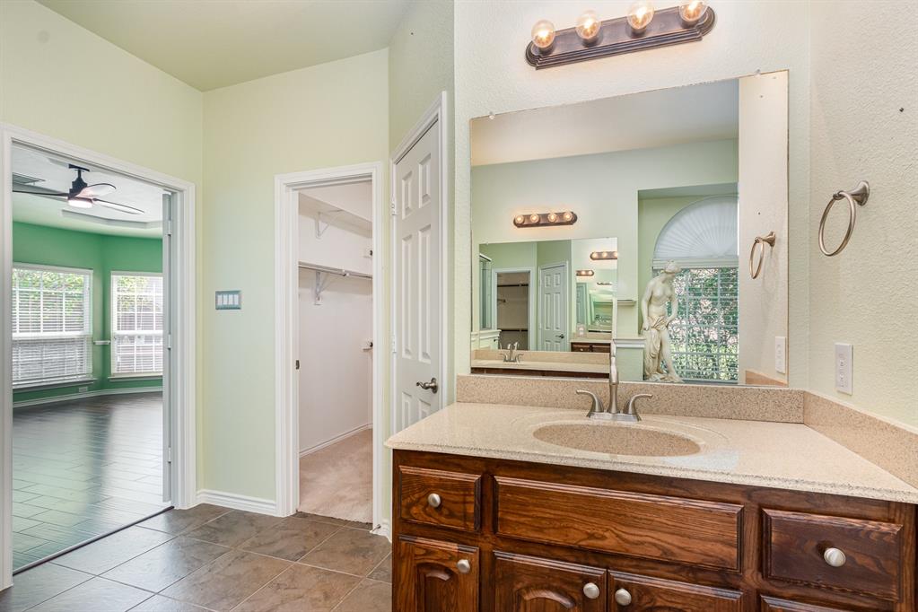 1325 Bateman Lane Celina, TX 75009 - Photo 19 of 39 a bathroom with a sink and a mirror