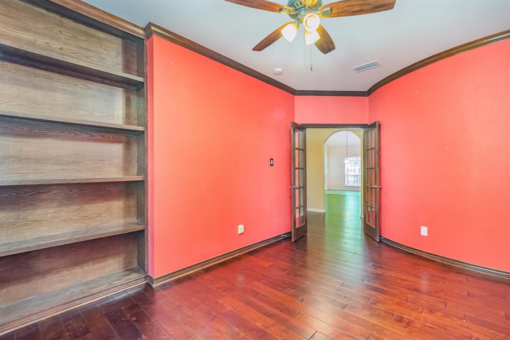 1325 Bateman Lane Celina, TX 75009 - Photo 22 of 39 a hallway with a large window with wooden floor