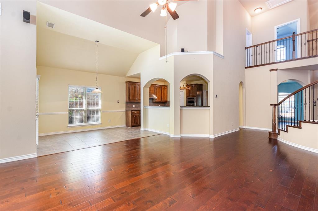 1325 Bateman Lane Celina, TX 75009 - Photo 4 of 39 wooden floor in an empty room with a window